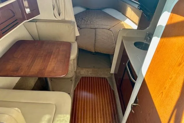 Slide: The Image of Twin engines of a 2009 Sea Ray Sundancer 280 boat, showcasing detailed mechanical components. - 18