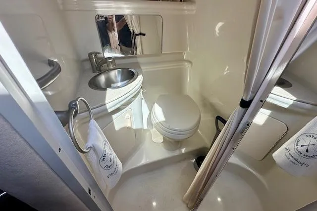 Slide: The Image of Covered 2009 Sea Ray Sundancer 280 boat, docked with protective tarp. - 22