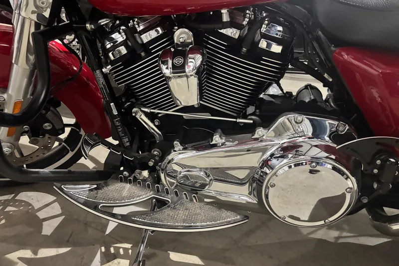 Slide: The Image of Close-up of a 2023 Ranger Z520R Cup-Equipped motorcycle engine and chrome details. - 3