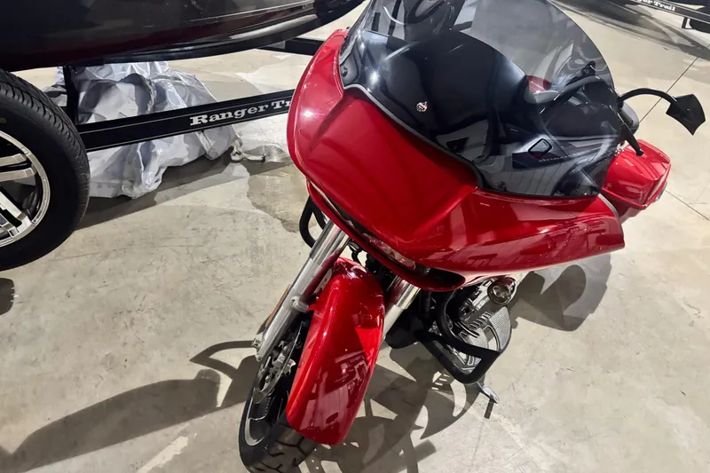 Slide: The Image of Red 2023 Ranger Z520R Cup-Equipped motorcycle with sleek design and black windshield. - 5