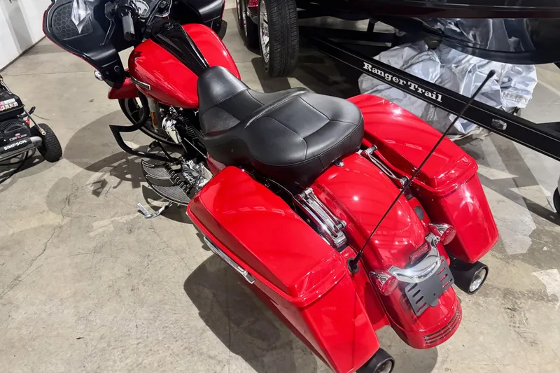 Slide: The Image of Red 2023 Ranger Z520R Cup-Equipped motorcycle with black seat, parked indoors. - 6