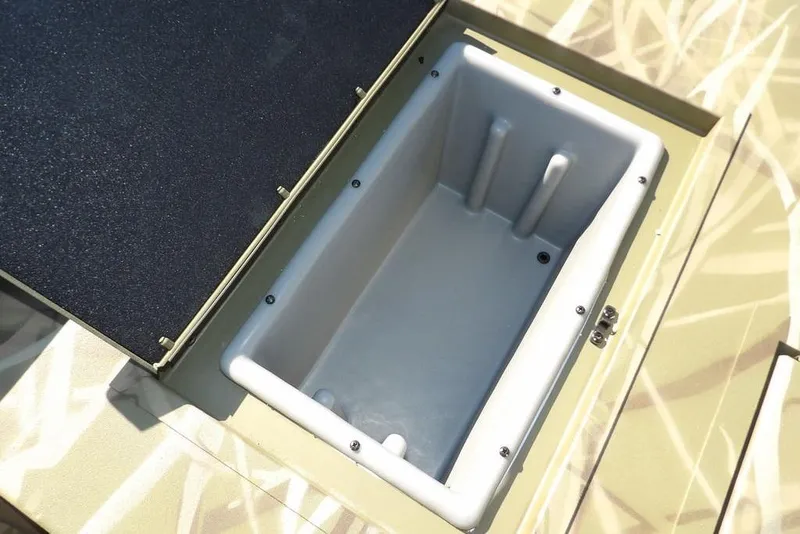 Slide: The Image of Open storage compartment in 2026 Crestliner XFC 189 boat, featuring a spacious interior. - 15