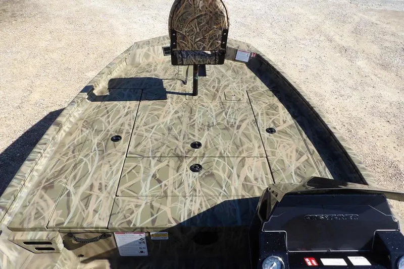 Slide: The Image of 2026 Crestliner XFC 189 boat with camouflage deck design, viewed from above. - 24