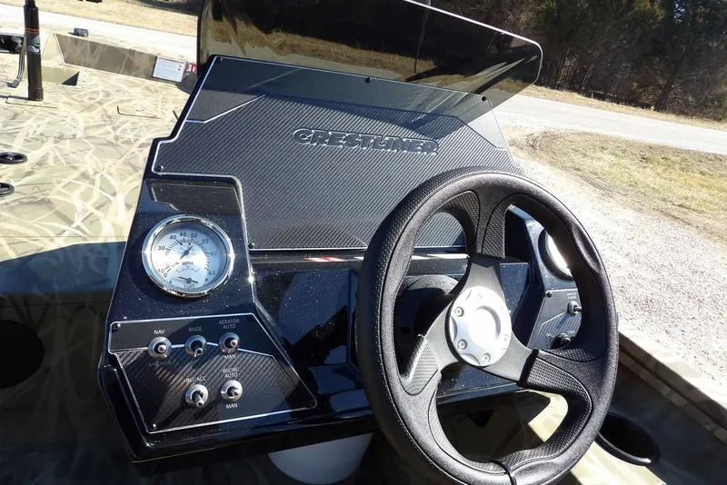 Slide: The Image of 2026 Crestliner XFC 189 boat dashboard with steering wheel and speedometer. - 25