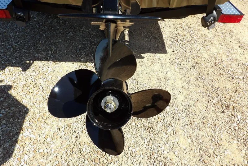 Slide: The Image of Propeller of 2026 Crestliner XFC 189 boat on gravel surface. - 30