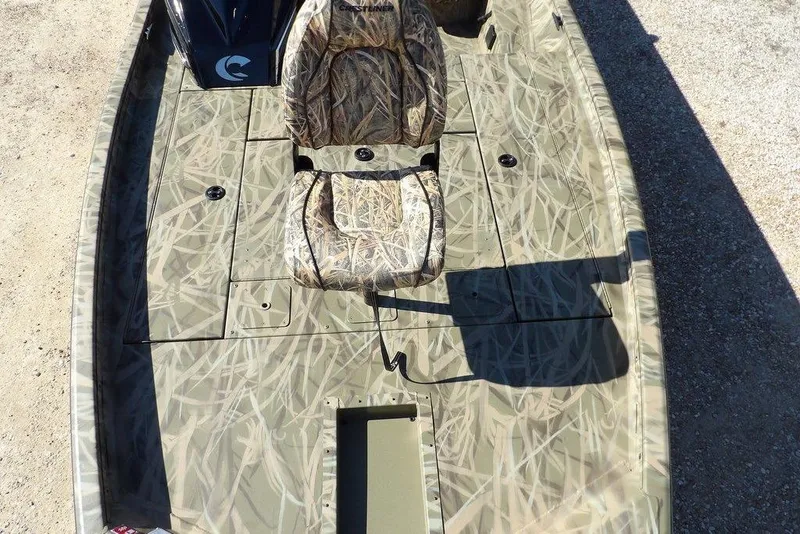 Slide: The Image of 2026 Crestliner XFC 189 boat with camouflage seating and deck, ideal for fishing. - 34