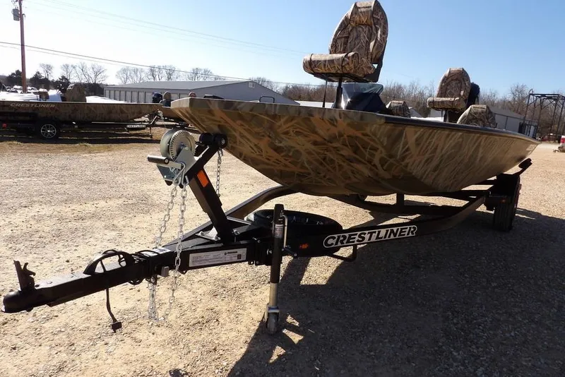 Slide: The Image of 2026 Crestliner XFC 189 boat with camouflage design on a trailer. - 38