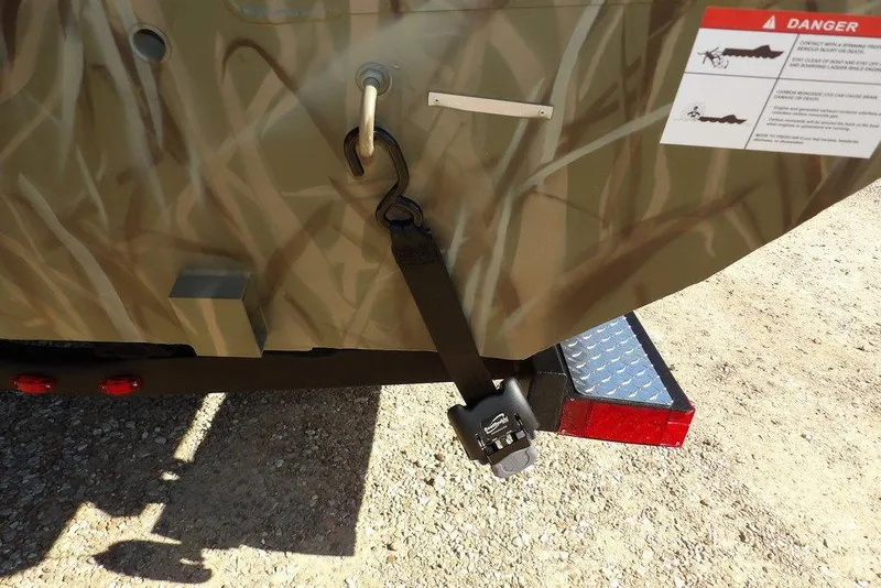 Slide: The Image of 2026 Crestliner XFC 189 boat with camouflage design and safety warning label. - 41