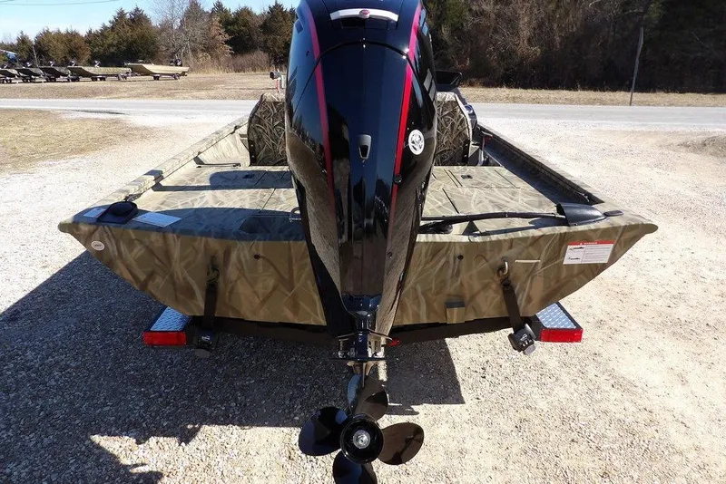 Slide: The Image of 2026 Crestliner XFC 189 boat with camouflage design and powerful outboard motor. - 5