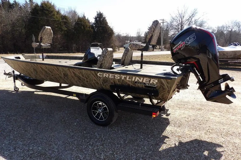 Slide: The Image of 2026 Crestliner XFC 189 fishing boat with camo design and powerful outboard motor. - 6