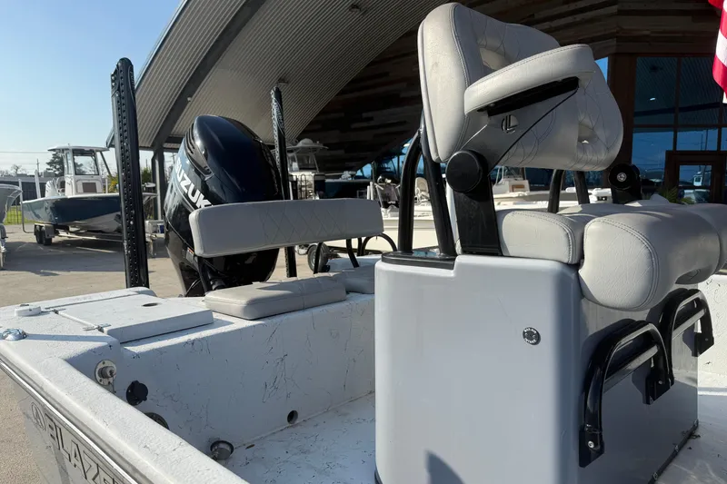 Slide: The Image of 2022 Blazer Bay 2400 boat with Suzuki engine, featuring comfortable seating and modern design. - 10