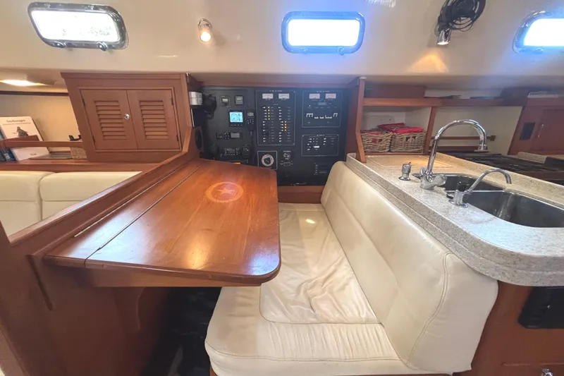 Slide: The Image of Interior of 2006 Island Packet 440 yacht with navigation station and galley sink. - 13