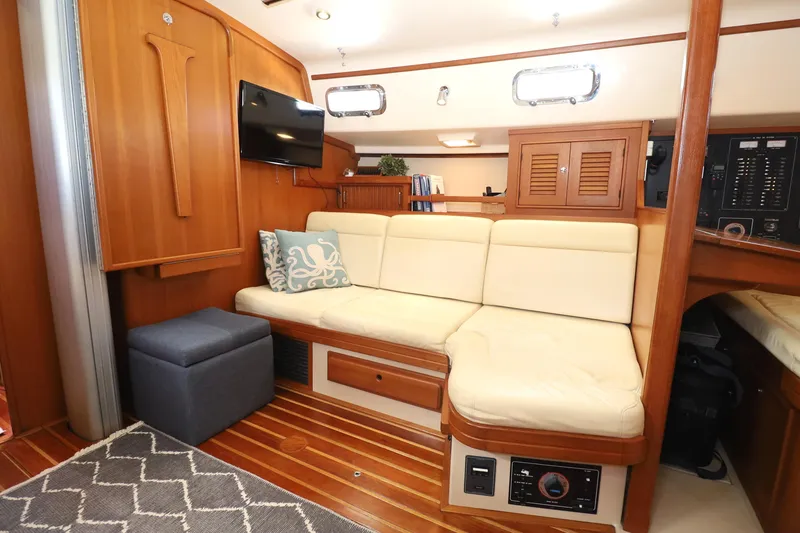 Slide: The Image of Luxurious 2006 Island Packet 440 yacht interior with cream leather seating and wooden accents. - 15