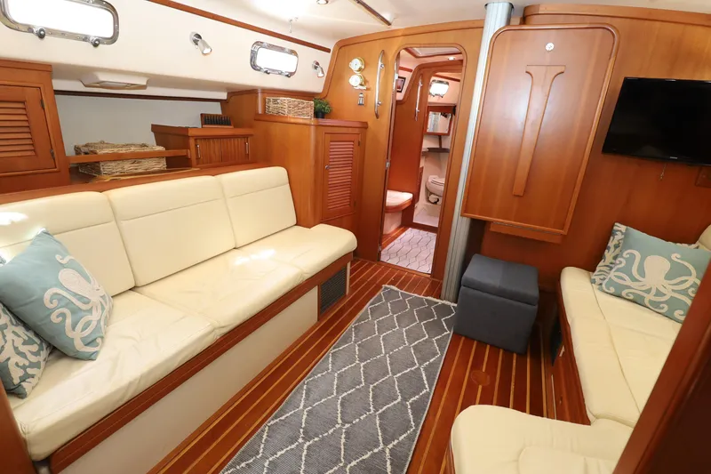 Slide: The Image of Luxurious 2006 Island Packet 440 yacht interior with elegant wood finish and comfortable seating. - 16