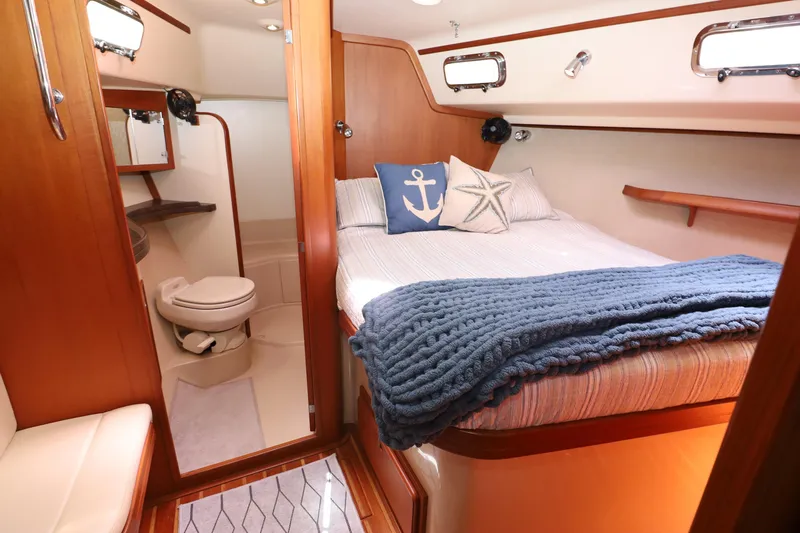 Slide: The Image of Luxurious 2006 Island Packet 440 yacht cabin with cozy bed and private bathroom. - 17