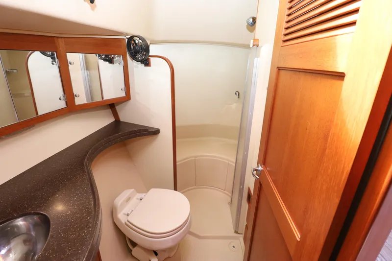 Slide: The Image of Luxurious bathroom in 2006 Island Packet 440 yacht with wooden accents and modern fixtures. - 18