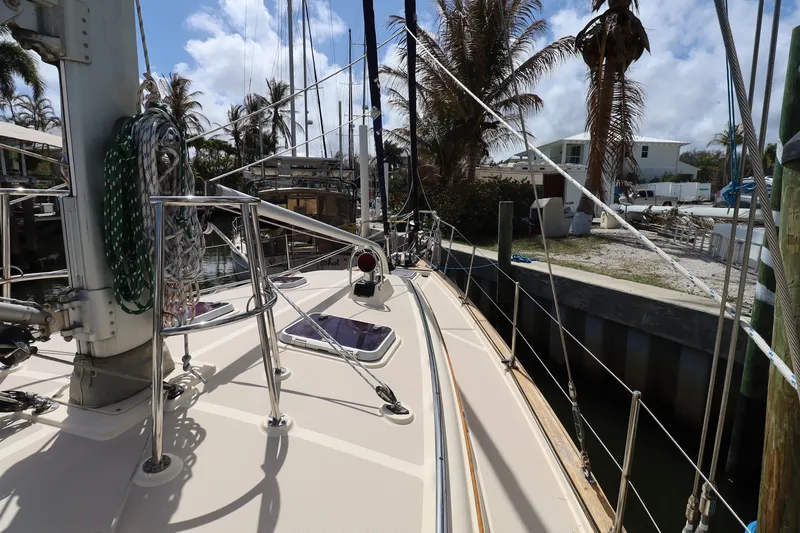 Slide: The Image of 2006 Island Packet 440 sailboat docked, featuring deck and rigging details. - 30