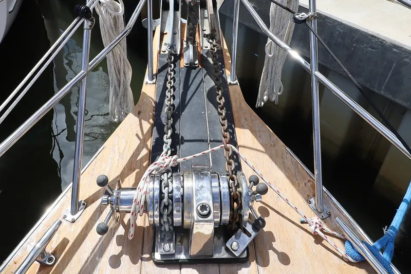 Slide: The Image of Bow of 2006 Island Packet 440 sailboat with anchor chain and winch. - 31