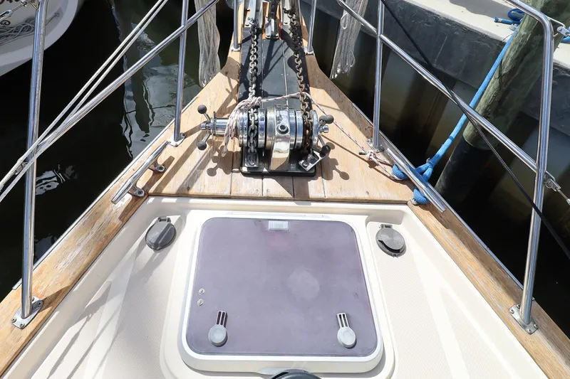 Slide: The Image of Deck of 2006 Island Packet 440 sailboat with anchor winch and hatch. - 32