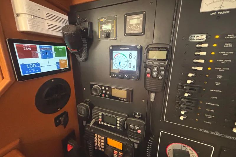 Slide: The Image of Control panel of a 2006 Island Packet 440 yacht with navigation and communication equipment. - 39