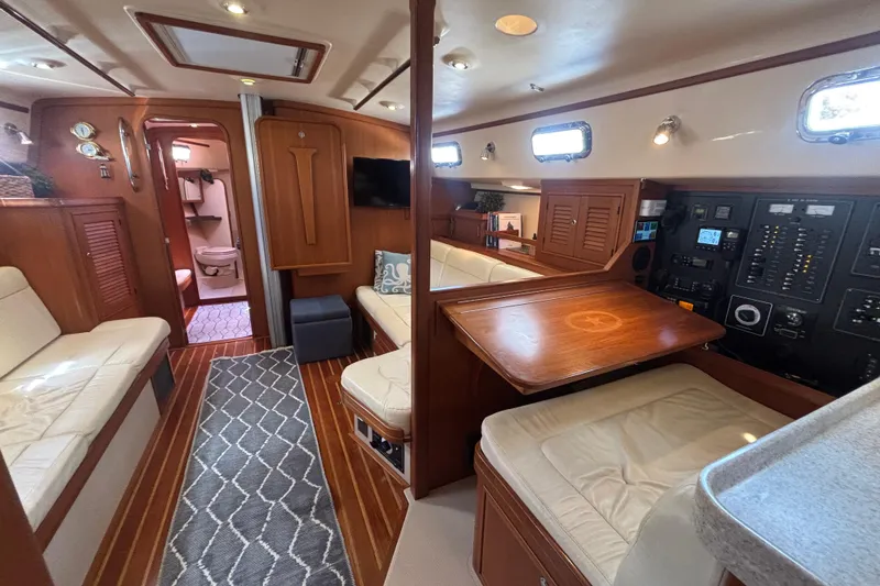 Slide: The Image of Luxurious interior of 2006 Island Packet 440 yacht with seating, table, and control panel. - 7