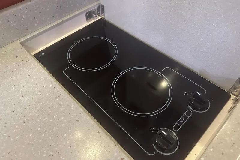 Slide: The Image of Built-in electric stove on a 2005 Formula 37 PC yacht kitchen countertop. - 18