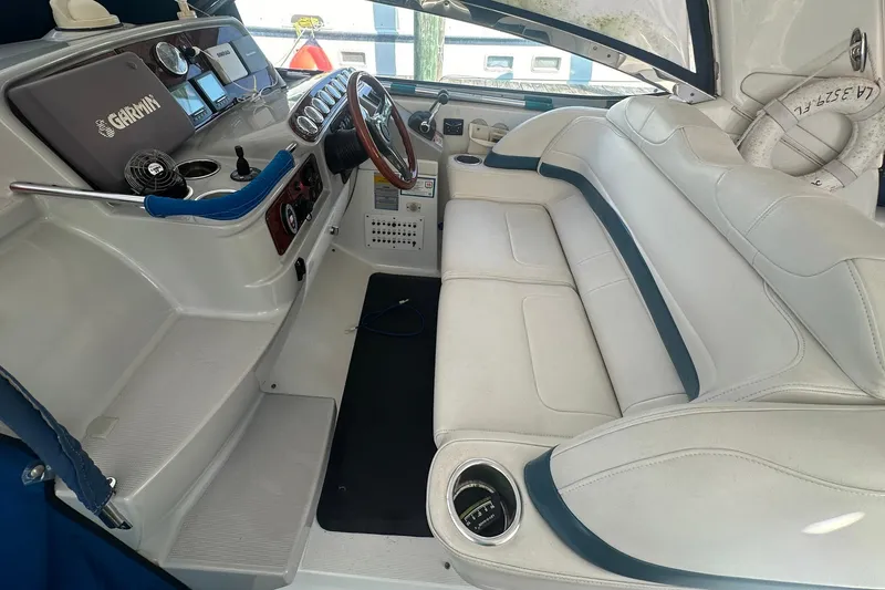 Slide: The Image of 2005 Formula 37 PC boat interior with white seating and navigation controls. - 5
