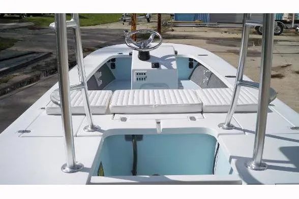 Slide: The Image of 2026 Mitzi Skiffs 17 Tournament boat with seating and Mercury engine at marina. - 4