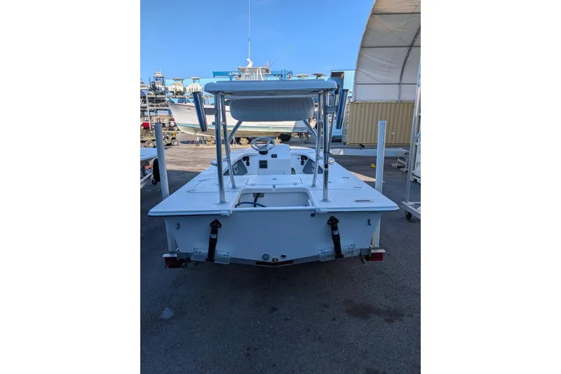 Slide: The Image of 2026 Mitzi Skiffs 17 Tournament boat with open storage compartments. - 6