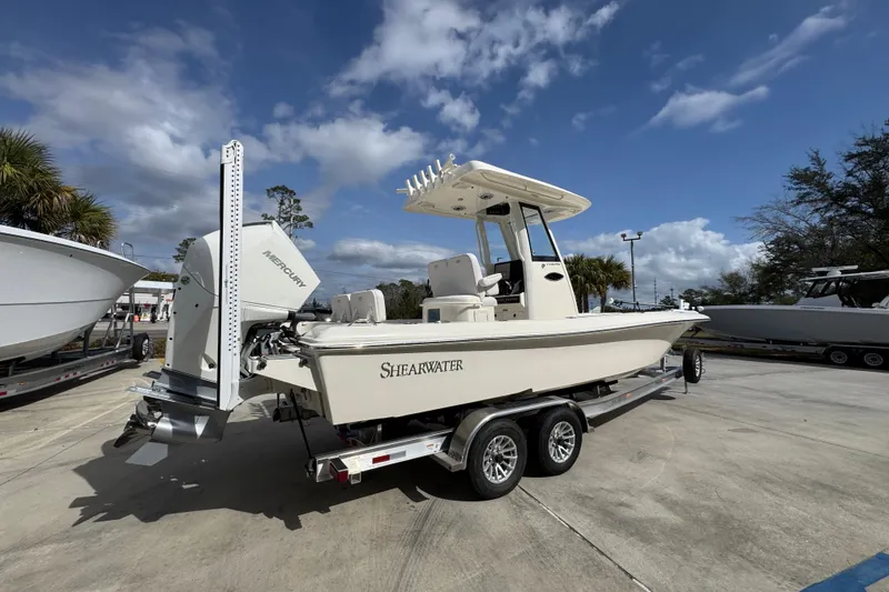Slide: The Image of 2026 ShearWater 270 SS Open Carolina boat on trailer under blue sky. - 10
