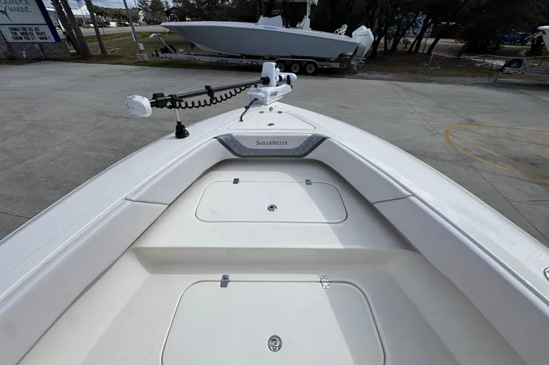 Slide: The Image of 2026 ShearWater 270 SS Open Carolina boat deck with storage compartments. - 16