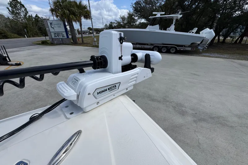 Slide: The Image of Minn Kota trolling motor on 2026 ShearWater 270 SS Open Carolina boat, parked outdoors. - 20