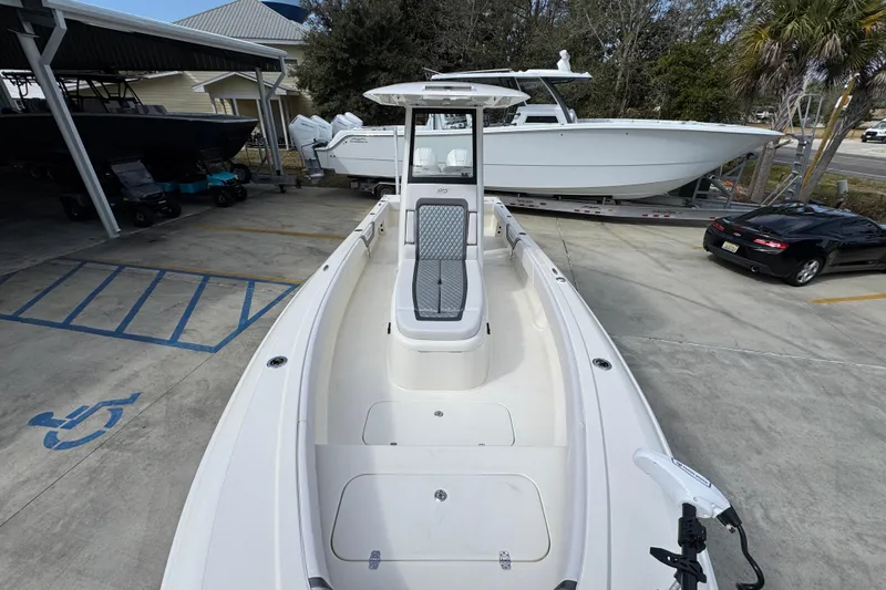 Slide: The Image of 2026 ShearWater 270 SS Open Carolina boat in a marina setting. - 21