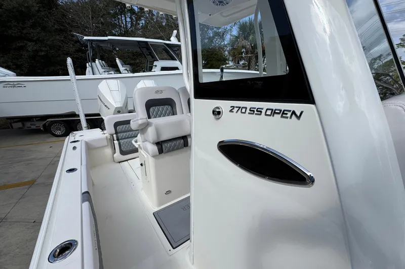 Slide: The Image of 2026 ShearWater 270 SS Open Carolina boat interior with seating and branding details. - 24