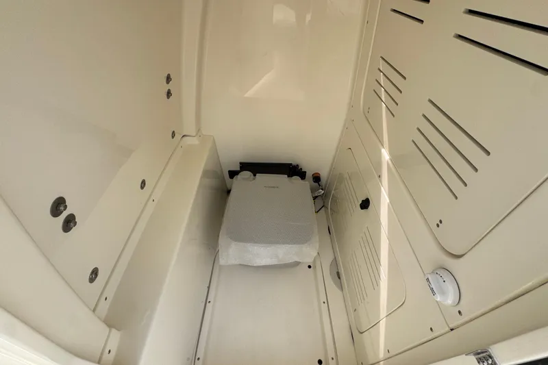 Slide: The Image of Interior of 2026 ShearWater 270 SS Open Carolina boat, featuring storage compartment. - 26