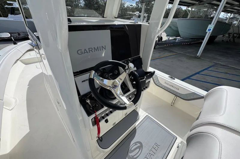Slide: The Image of 2026 ShearWater 270 SS Open Carolina boat cockpit with Garmin navigation system. - 29