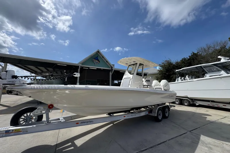 Slide: The Image of 2026 ShearWater 270 SS Open Carolina boat on trailer under blue sky. - 3