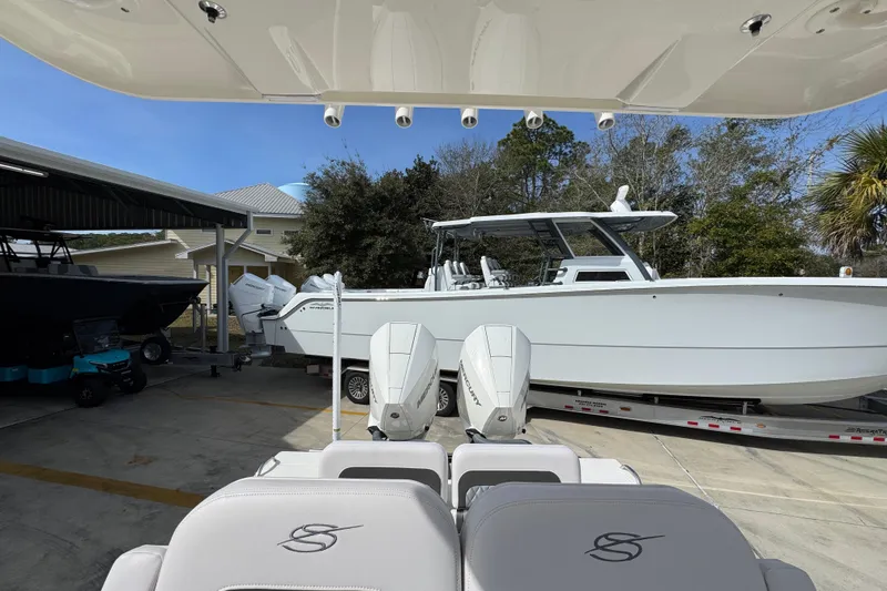 Slide: The Image of 2026 ShearWater 270 SS Open Carolina boat on trailer, viewed from rear seats. - 30