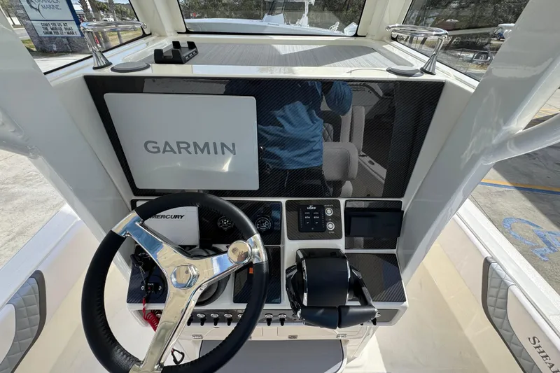 Slide: The Image of 2026 ShearWater 270 SS Open Carolina boat dashboard with Garmin navigation system. - 31