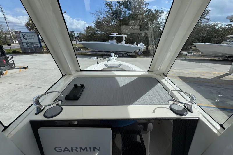 Slide: The Image of Interior view of 2026 ShearWater 270 SS Open Carolina boat with Garmin equipment. - 32
