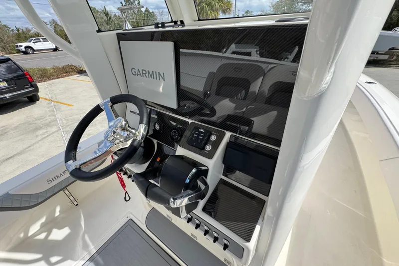 Slide: The Image of 2026 ShearWater 270 SS Open Carolina boat dashboard with Garmin navigation system. - 33