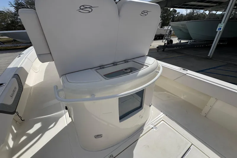 Slide: The Image of 2026 ShearWater 270 SS Open Carolina boat interior with seating and storage. - 35