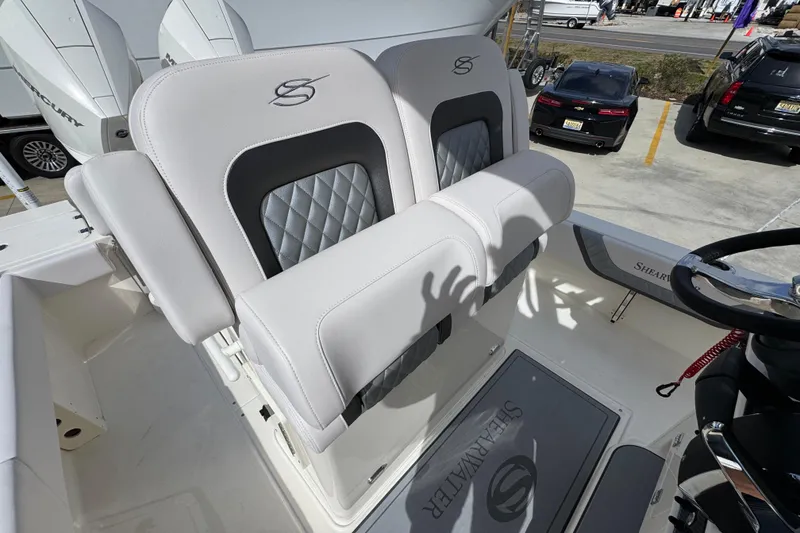 Slide: The Image of 2026 ShearWater 270 SS Open Carolina boat seats and helm, showcasing luxury design. - 36