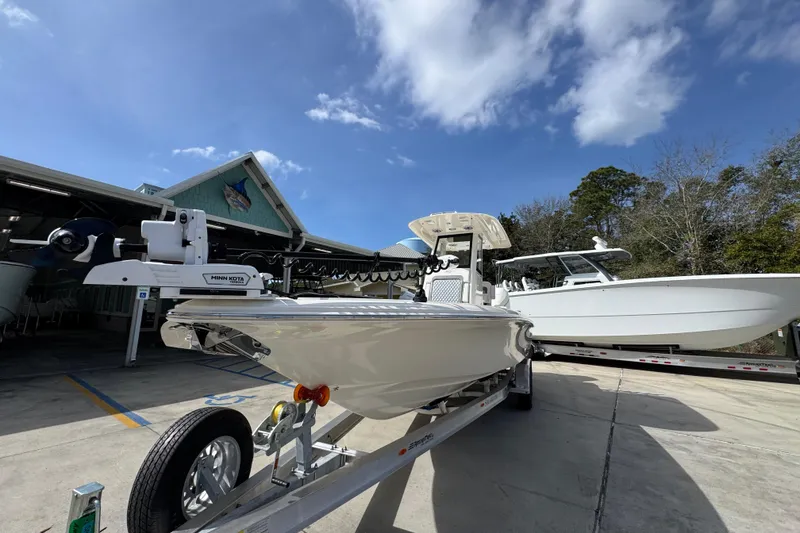 Slide: The Image of 2026 ShearWater 270 SS Open Carolina boat on trailer under clear blue sky. - 4