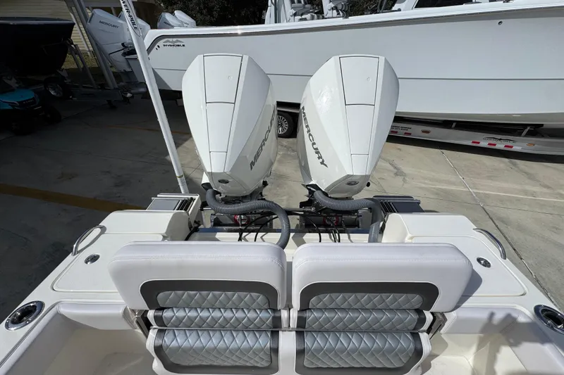 Slide: The Image of 2026 ShearWater 270 SS Open Carolina boat with dual Mercury engines, rear seating view. - 40