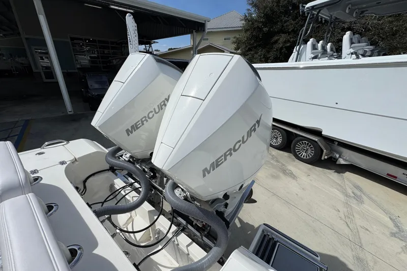 Slide: The Image of Twin Mercury outboard engines on a 2026 ShearWater 270 SS Open Carolina boat. - 42