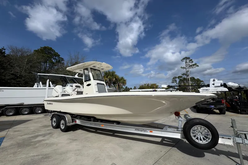 Slide: The Image of 2026 ShearWater 270 SS Open Carolina boat on trailer under blue sky. - 8
