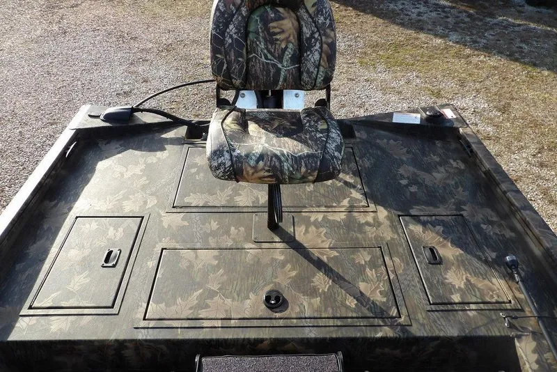 Slide: The Image of 2026 Crestliner XF 189 boat with camo seat and deck design. - 12