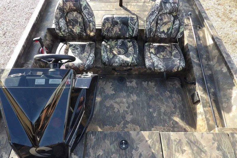 Slide: The Image of 2026 Crestliner XF 189 boat interior with camouflage seats and steering console. - 17