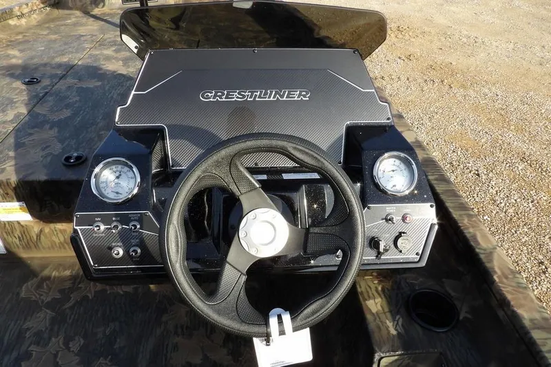 Slide: The Image of 2026 Crestliner XF 189 boat dashboard with steering wheel and gauges. - 20